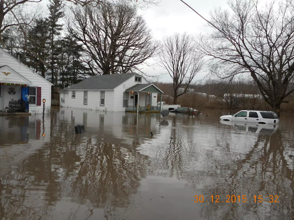 floodwaters up to an SUVs tires