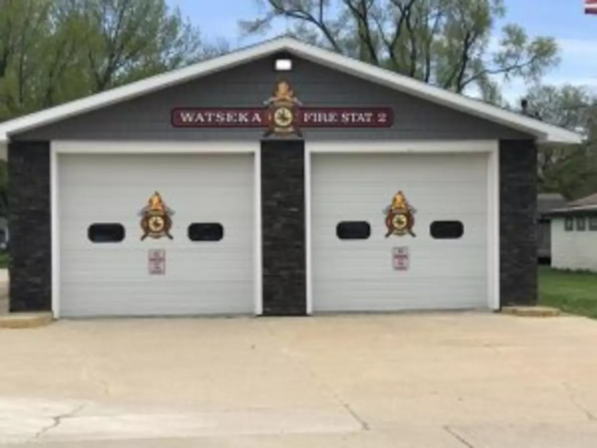 white garage doors on the green fire station